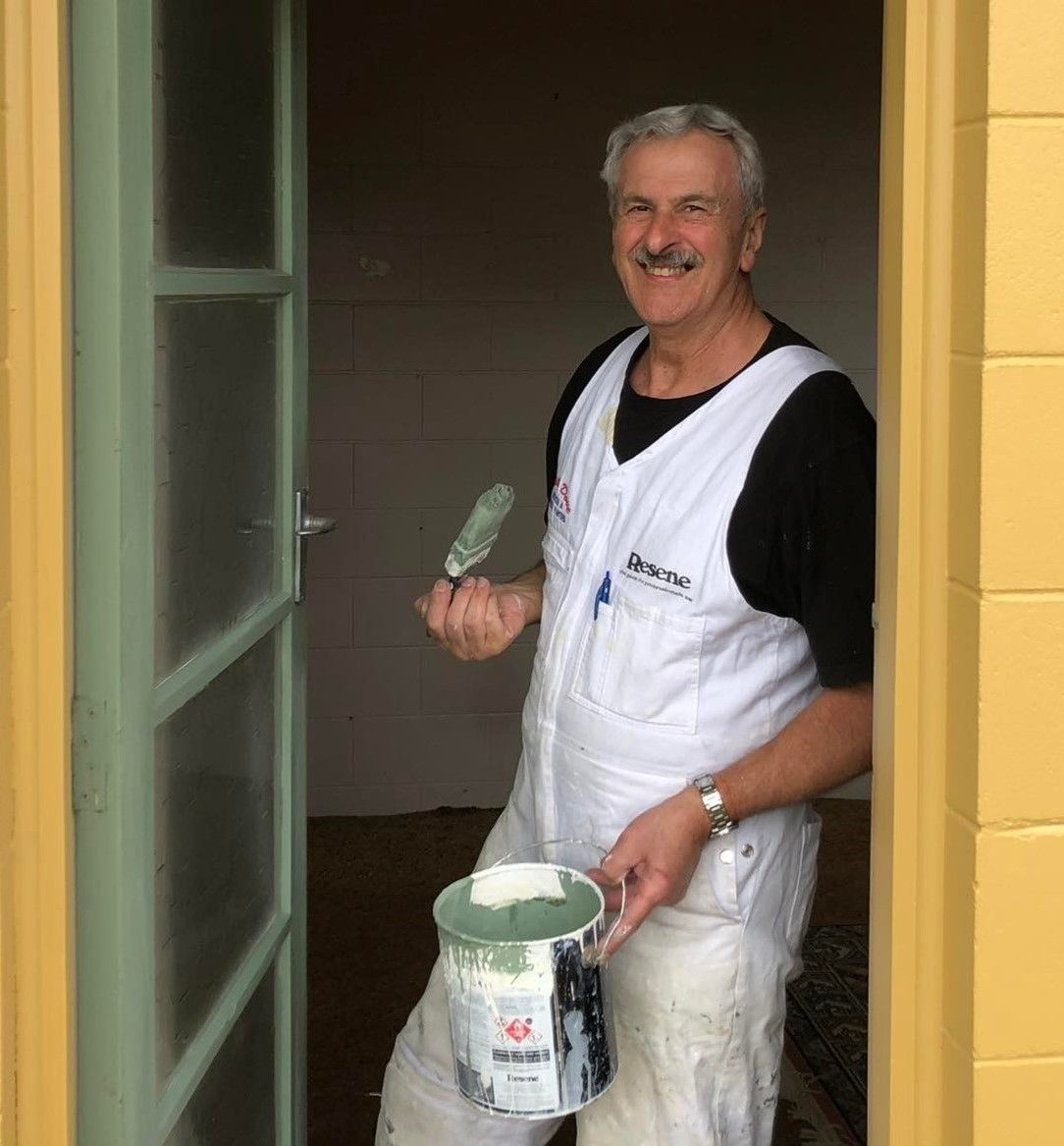 Phillip painting a door